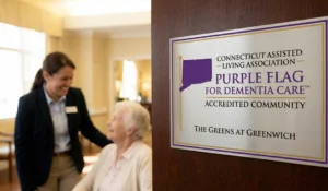 The Purple Flag accreditation emblem at The Greens at Greenwich, representing the highest standard of Purple Flag accredited memory care in CT.